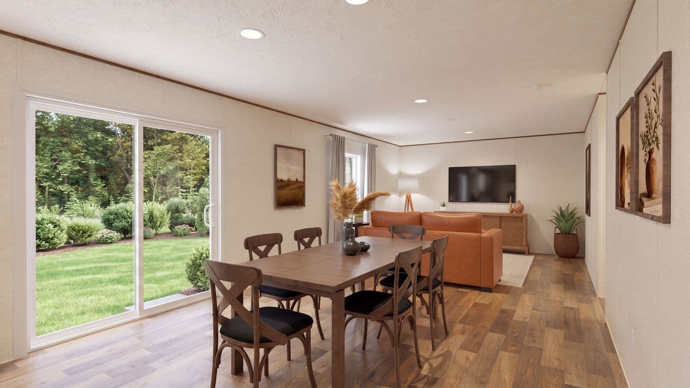 The CEDAR Dining Area. This Manufactured Mobile Home features 3 bedrooms and 2 baths.
