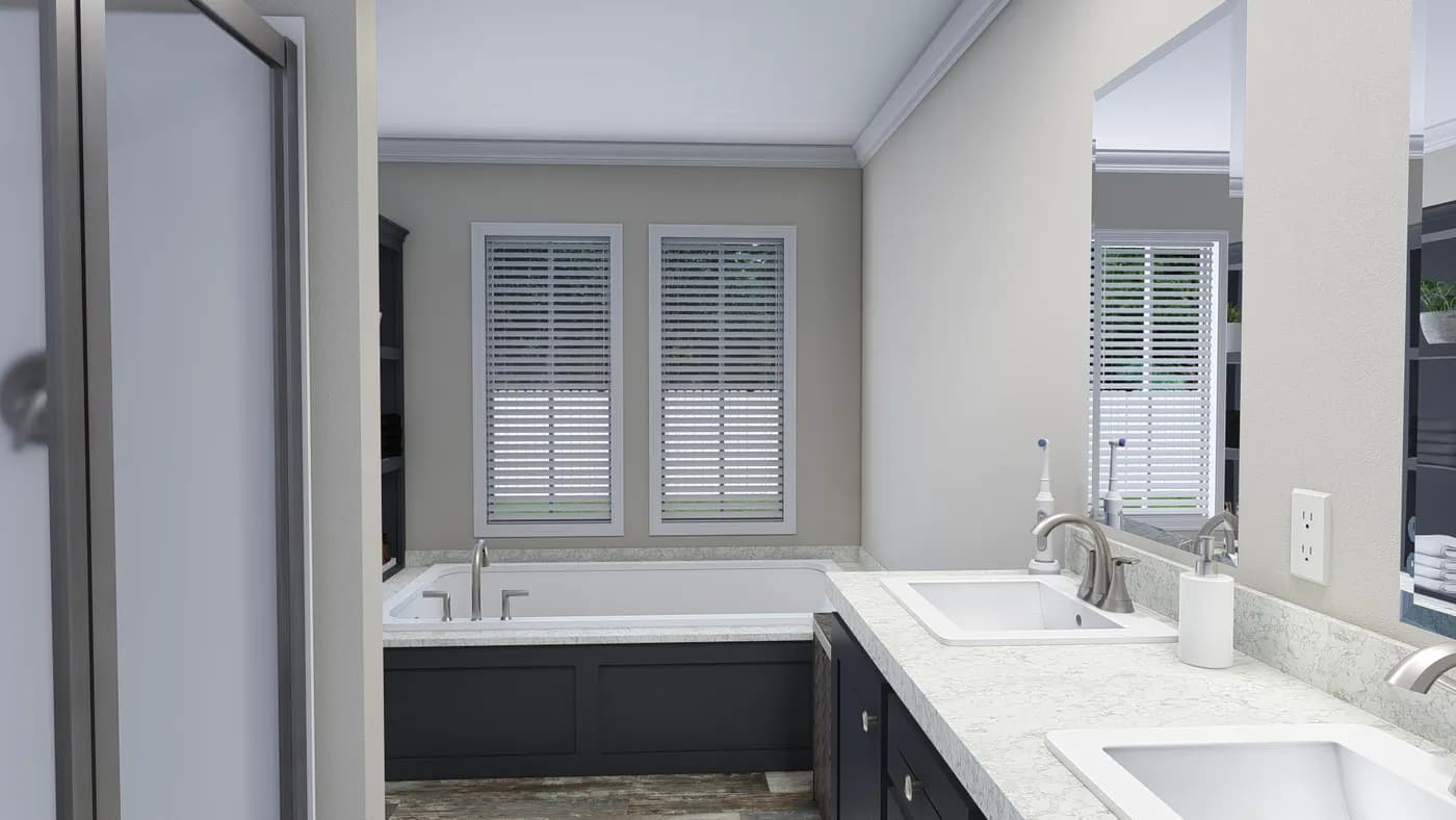 The CAROLINIAN M5000 Primary Bathroom. This Manufactured Mobile Home features 3 bedrooms and 2 baths.