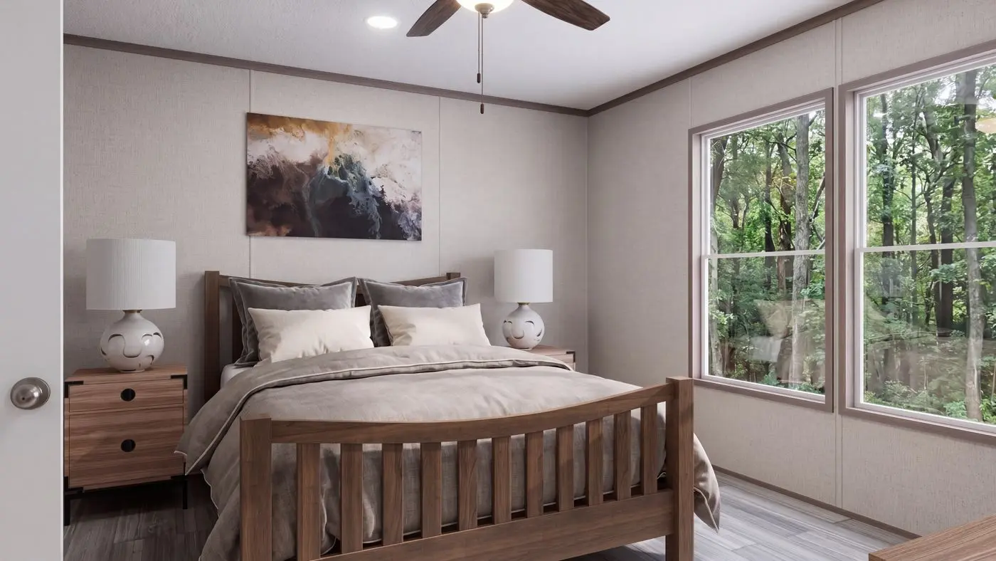 The THE MOUNTAINEER 60 Primary Bedroom. This Manufactured Mobile Home features 3 bedrooms and 2 baths.