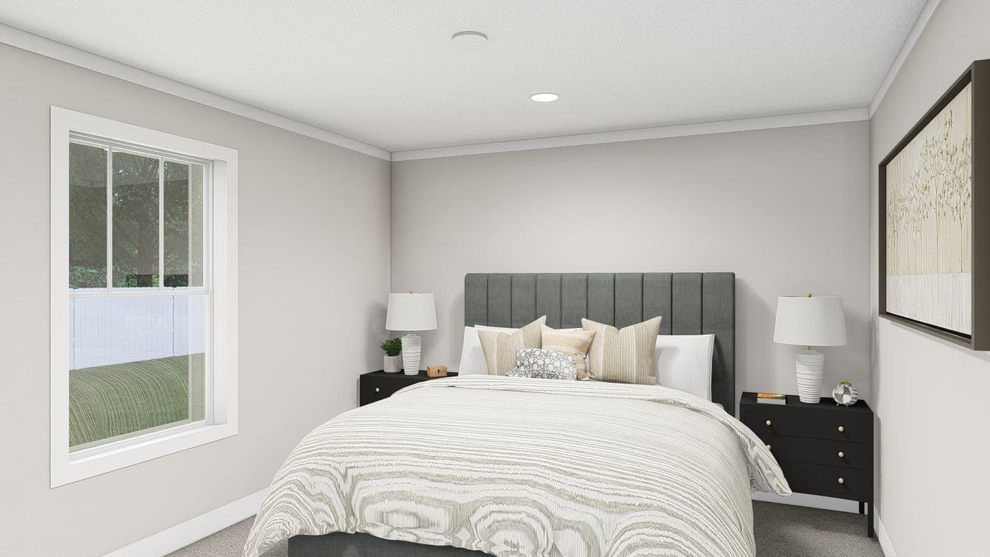 The HERE COMES THE SUN Primary Bedroom. This Manufactured Mobile Home features 3 bedrooms and 2 baths.