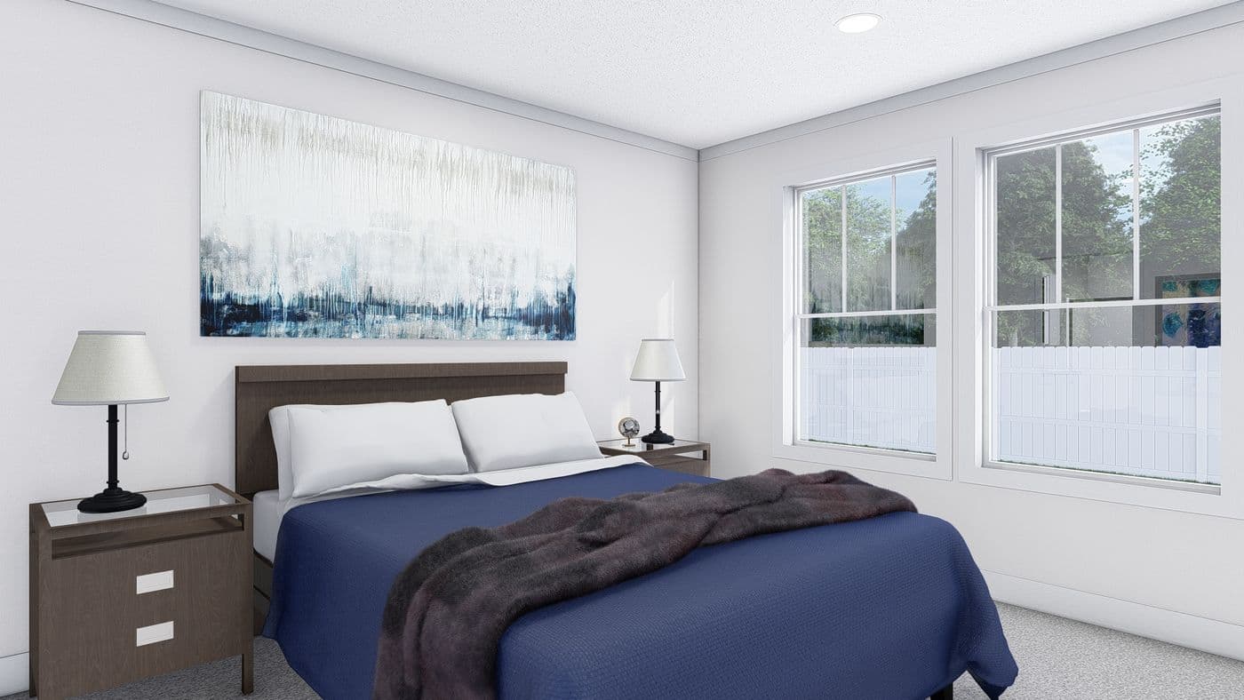 The JOHNNY B GOODE Primary Bedroom. This Manufactured Mobile Home features 3 bedrooms and 2 baths.