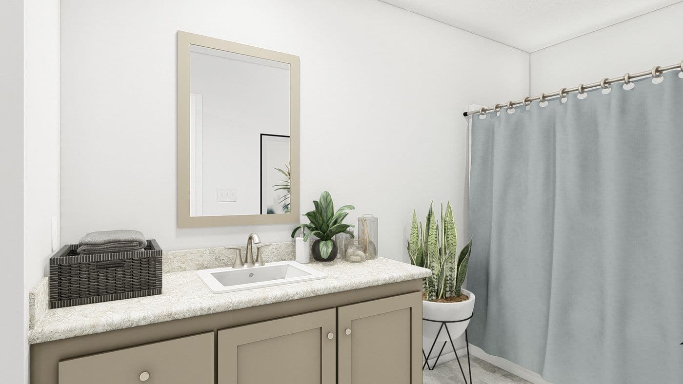 The DRM603N 1560' DREAM Primary Bathroom. This Manufactured Mobile Home features 2 bedrooms and 2 baths.