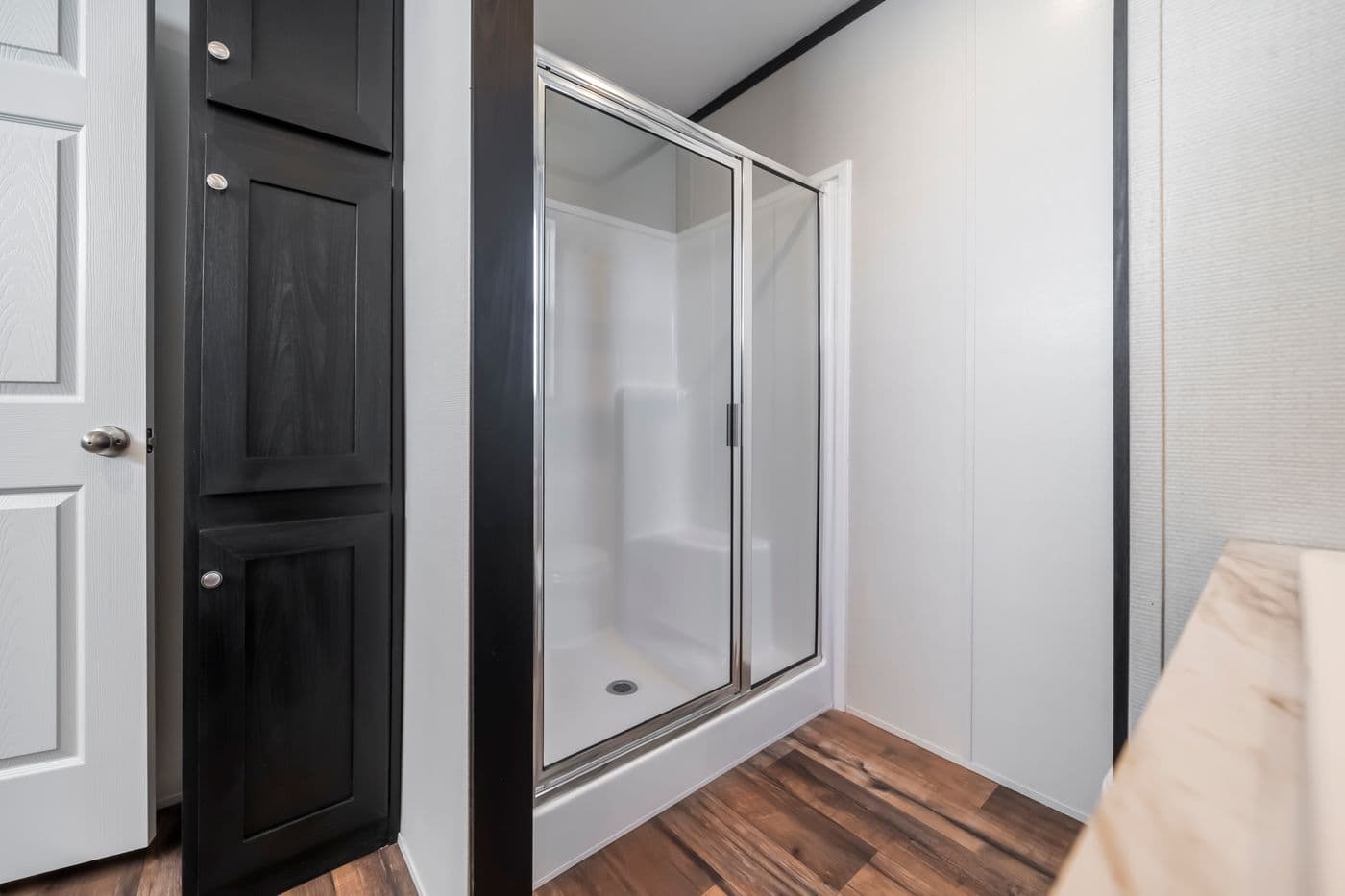 The RAVENWOOD Primary Bathroom. This Manufactured Mobile Home features 3 bedrooms and 2 baths.