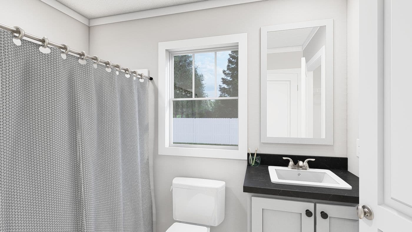 The YESTERDAY Guest Bathroom. This Manufactured Mobile Home features 1 bedroom and 1 bath.