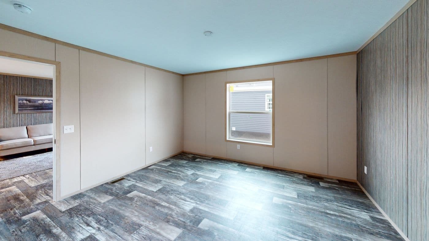 The HANCOCK Primary Bedroom. This Manufactured Mobile Home features 4 bedrooms and 2 baths.