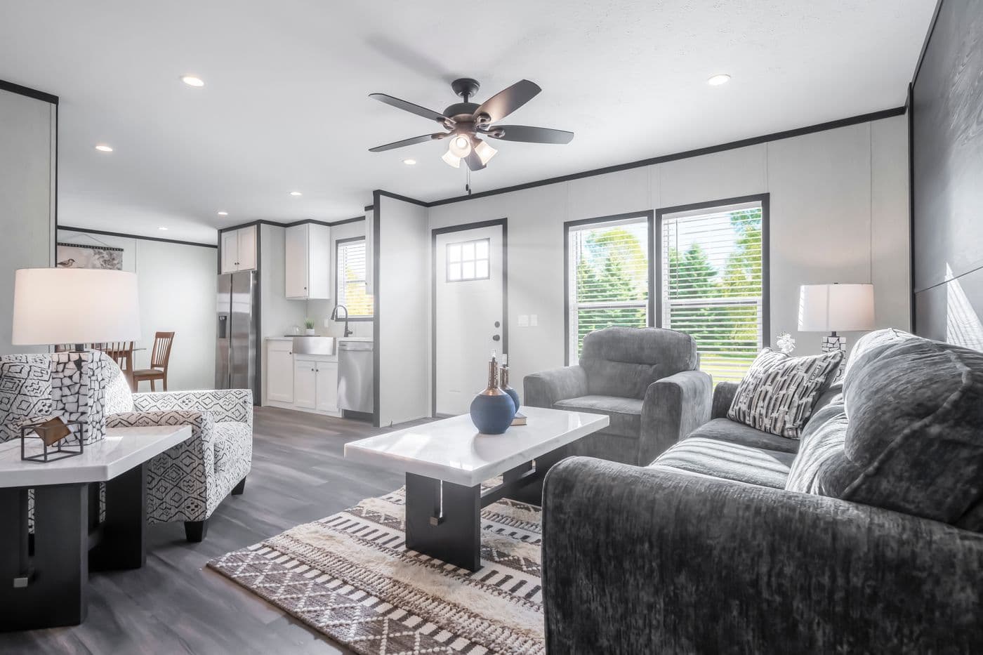 The LIL SOUTHERN CHARM Living Room. This Manufactured Mobile Home features 3 bedrooms and 2 baths.