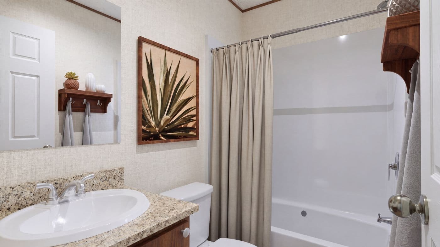 The DOGWOOD Guest Bathroom. This Manufactured Mobile Home features 2 bedrooms and 2 baths.