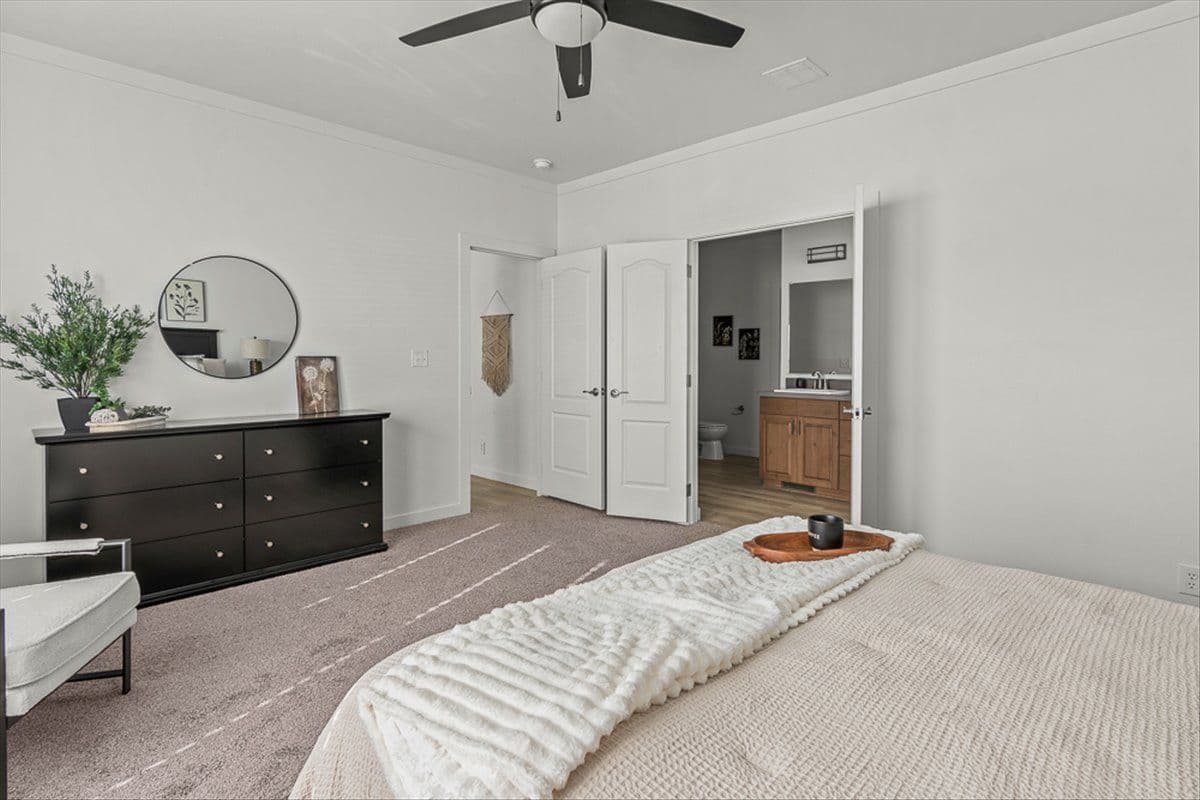 The TU3076A MEGA TUNDRA Primary Bedroom. This Manufactured Mobile Home features 4 bedrooms and 2 baths.