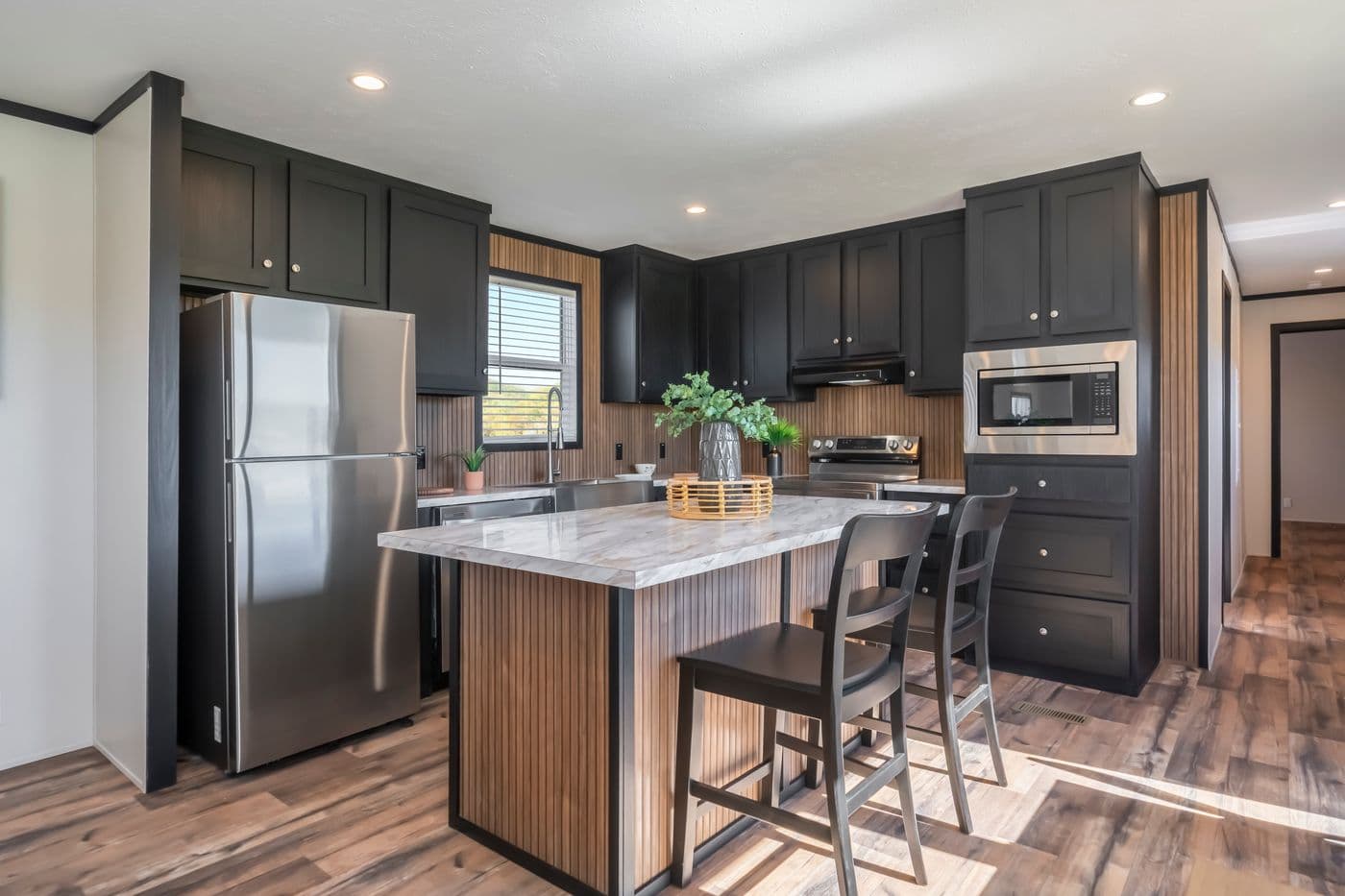 The RAVENWOOD Kitchen. This Manufactured Mobile Home features 3 bedrooms and 2 baths.