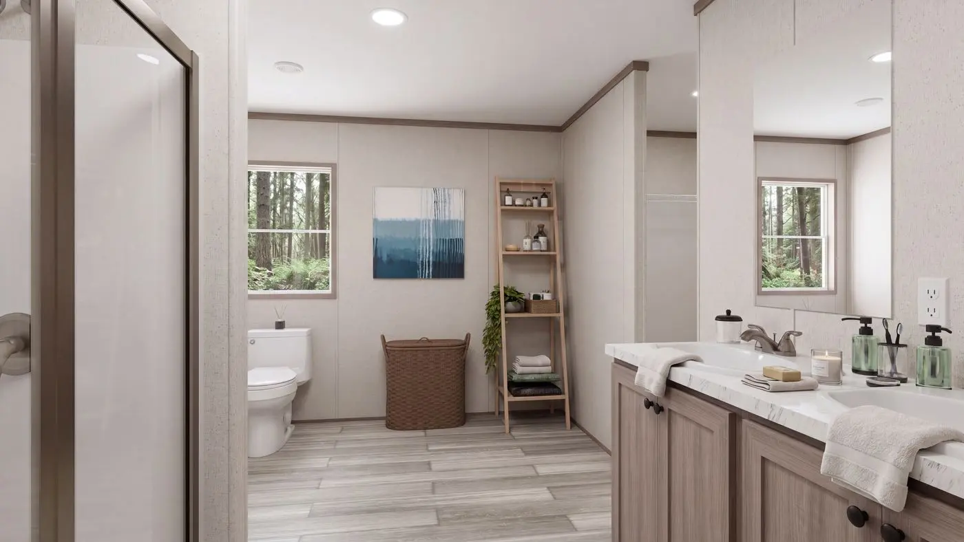 The THE MOUNTAINEER 60 Primary Bathroom. This Manufactured Mobile Home features 3 bedrooms and 2 baths.