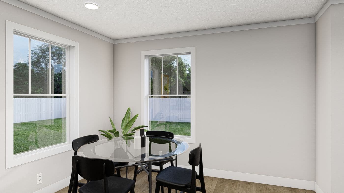 The THREE LITTLE BIRDS Dining Room. This Manufactured Mobile Home features 3 bedrooms and 2 baths.
