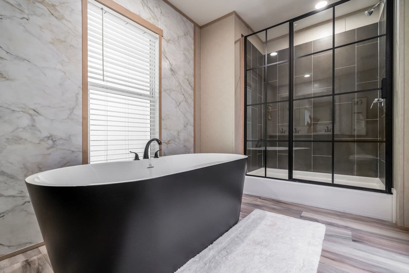 The ANNIVERSARY JEWEL Primary Bathroom. This Manufactured Mobile Home features 3 bedrooms and 2 baths.