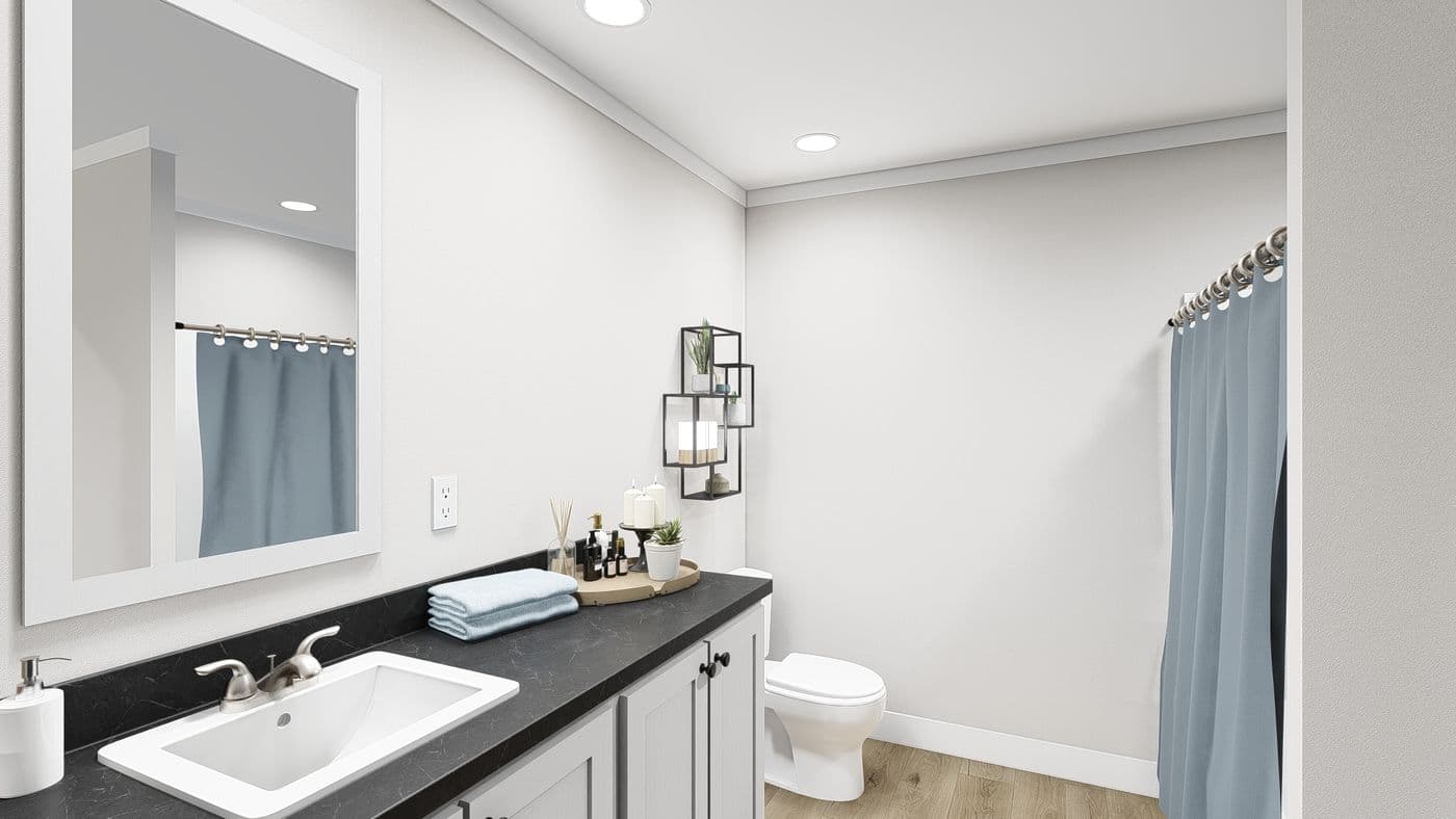 The LEAN ON ME Guest Bathroom. This Manufactured Mobile Home features 3 bedrooms and 2 baths.