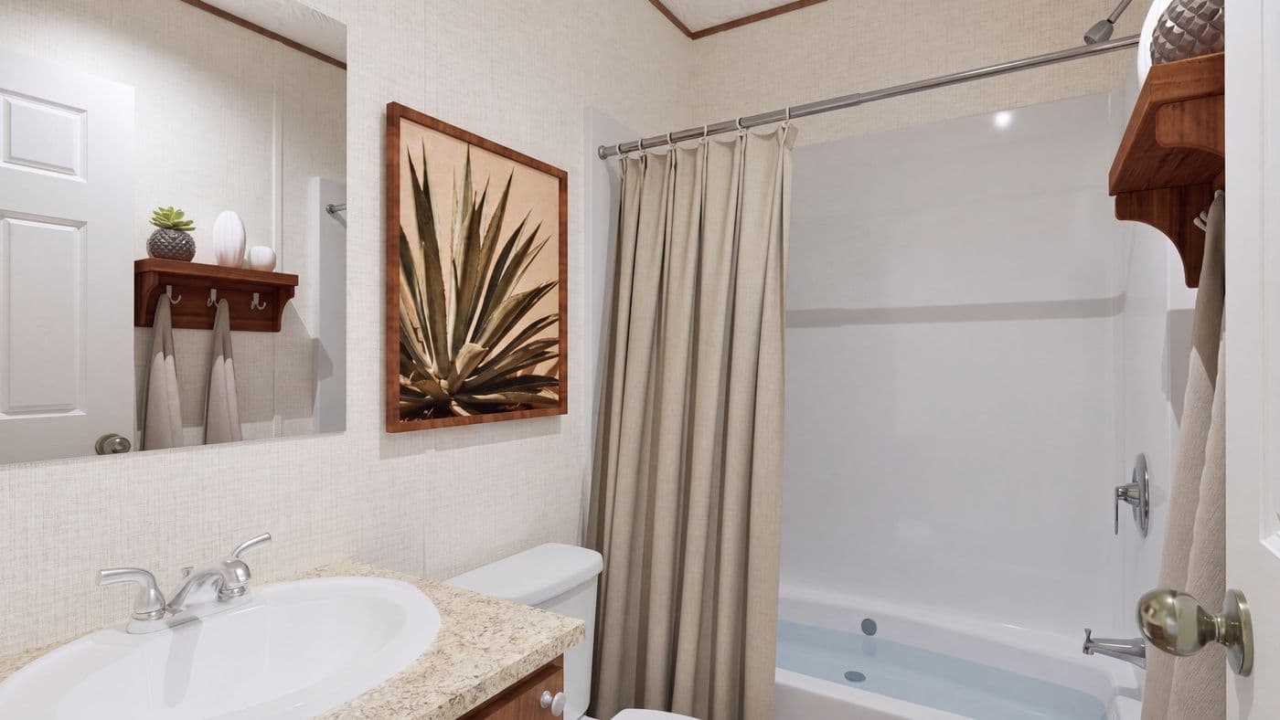 The HICKORY Guest Bathroom. This Manufactured Mobile Home features 3 bedrooms and 2 baths.