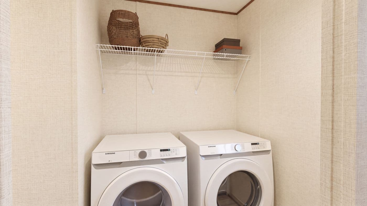 The CEDAR Utility Room. This Manufactured Mobile Home features 3 bedrooms and 2 baths.