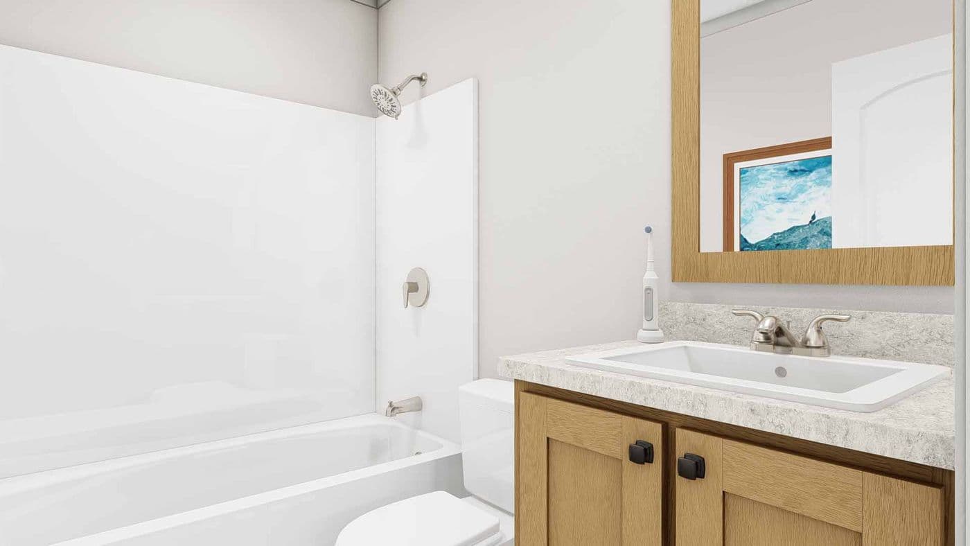The STAND BY ME Guest Bathroom. This Manufactured Mobile Home features 3 bedrooms and 2 baths.