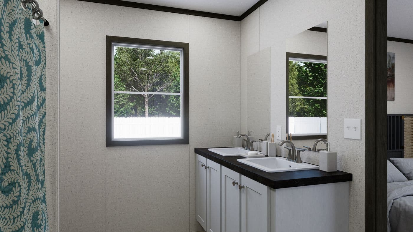 The THE SPARK Primary Bathroom. This Manufactured Mobile Home features 3 bedrooms and 2 baths.