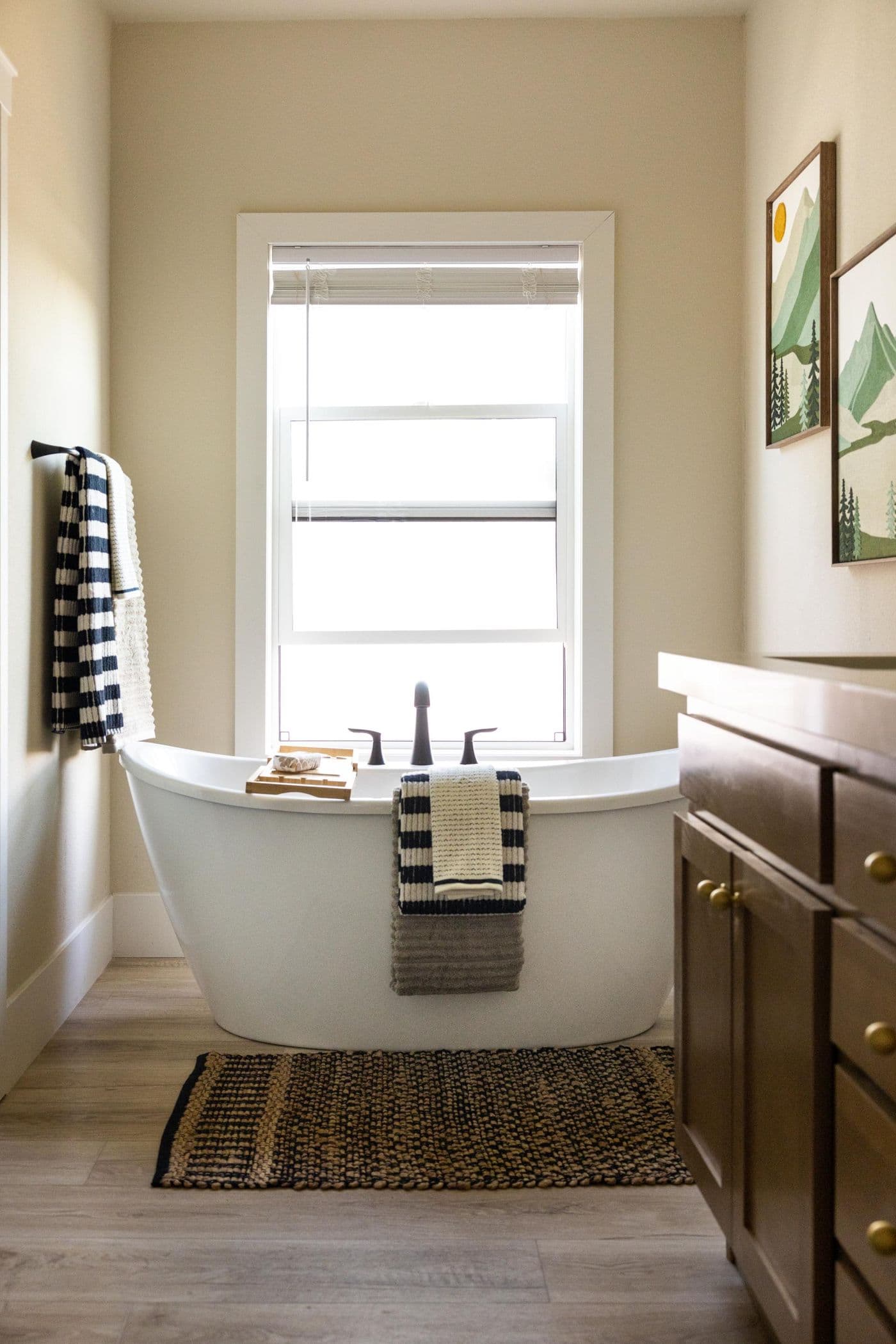 The ELEANOR Primary Bathroom. This modern manufactured home features 3 bedrooms, 2 baths. Pictured here: Primary Bath with a deep soaking tub.