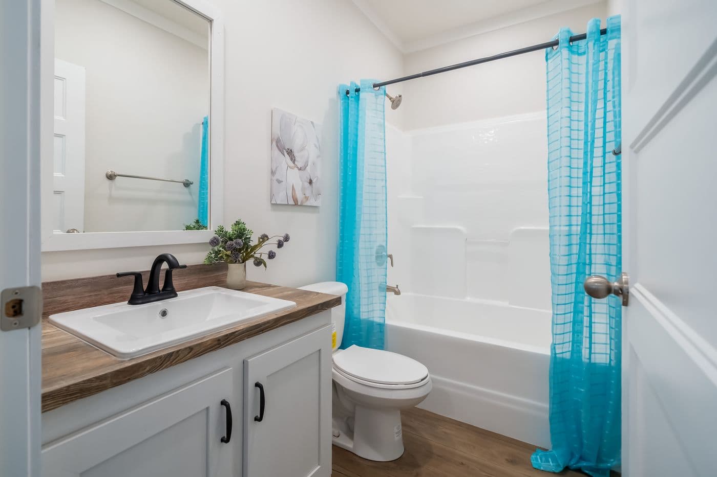 The 3459 MOD 64X28 CAROLINA Guest Bathroom. This Modular Home features 3 bedrooms and 2 baths.