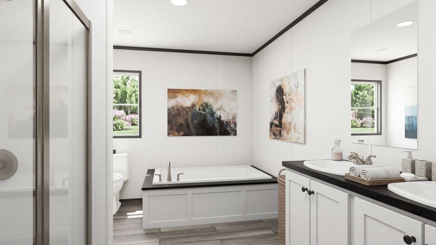 The THE MOUNTAINEER 56 Primary Bathroom. This Manufactured Mobile Home features 3 bedrooms and 2 baths.