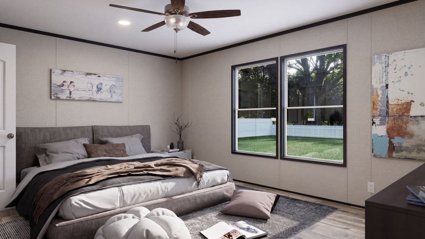 The THE MOUNTAINEER 52 Primary Bedroom. This Manufactured Mobile Home features 3 bedrooms and 2 baths.
