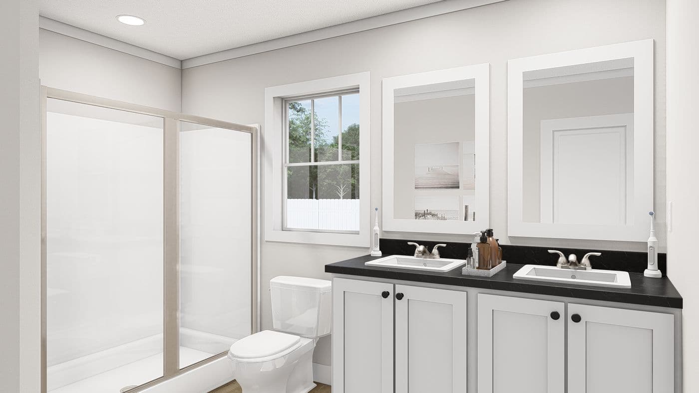 The WHOLE LOTTA LOVE Primary Bathroom. This Manufactured Mobile Home features 3 bedrooms and 2 baths.