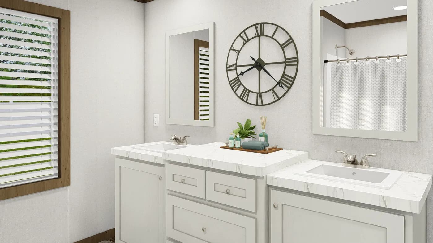 The HOMESTEAD BREEZE Guest Bathroom. This Manufactured Mobile Home features 4 bedrooms and 2 baths.
