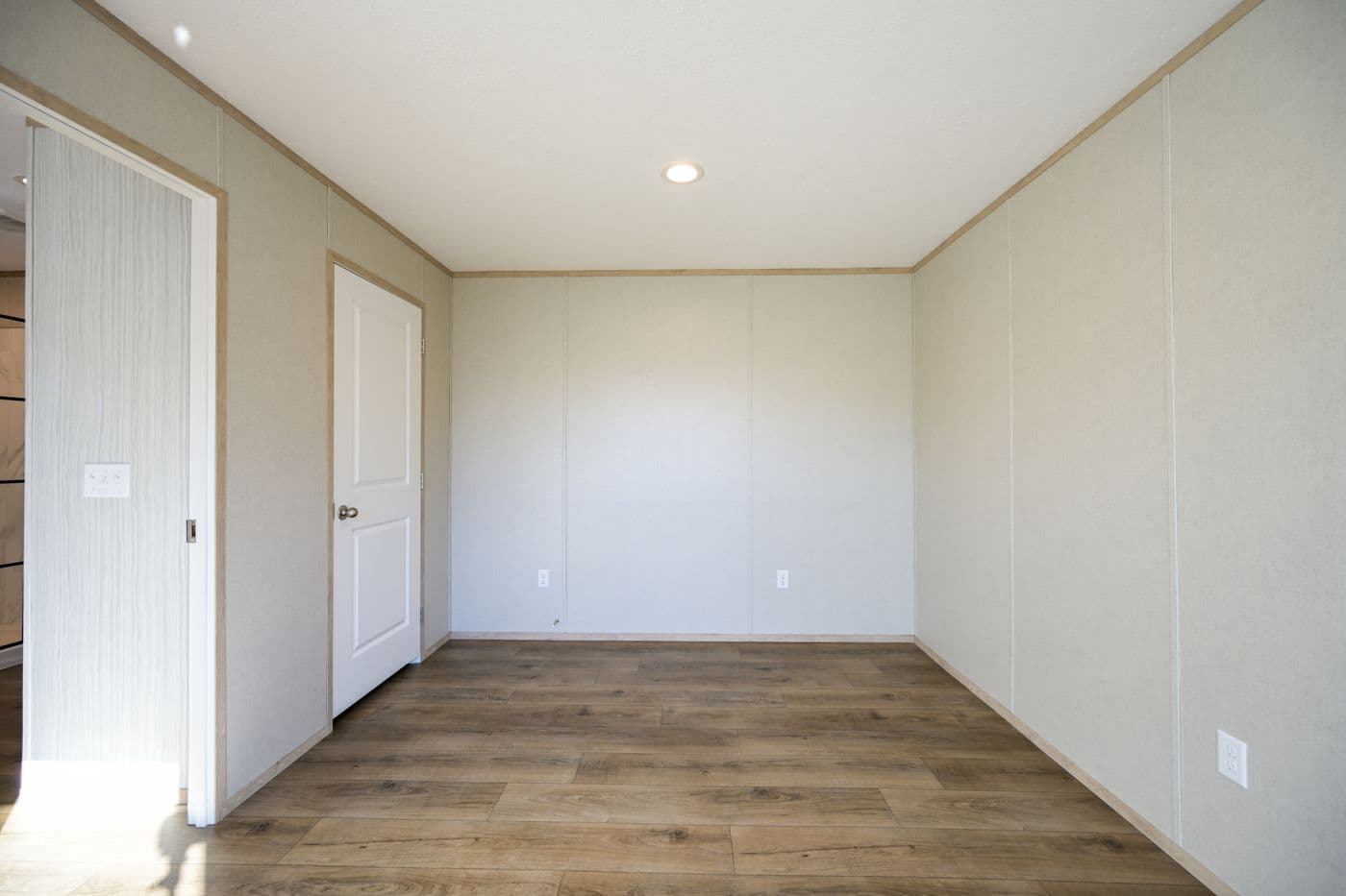 The TIGER'S EYE 7416-456 Primary Bedroom. This Manufactured Mobile Home features 3 bedrooms and 2 baths.