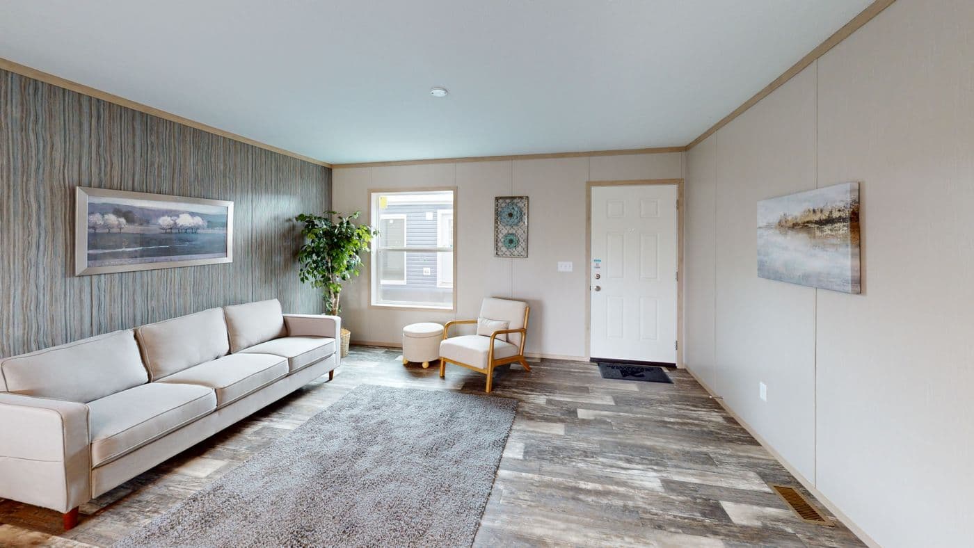 The HANCOCK Living Room. This Manufactured Mobile Home features 4 bedrooms and 2 baths.