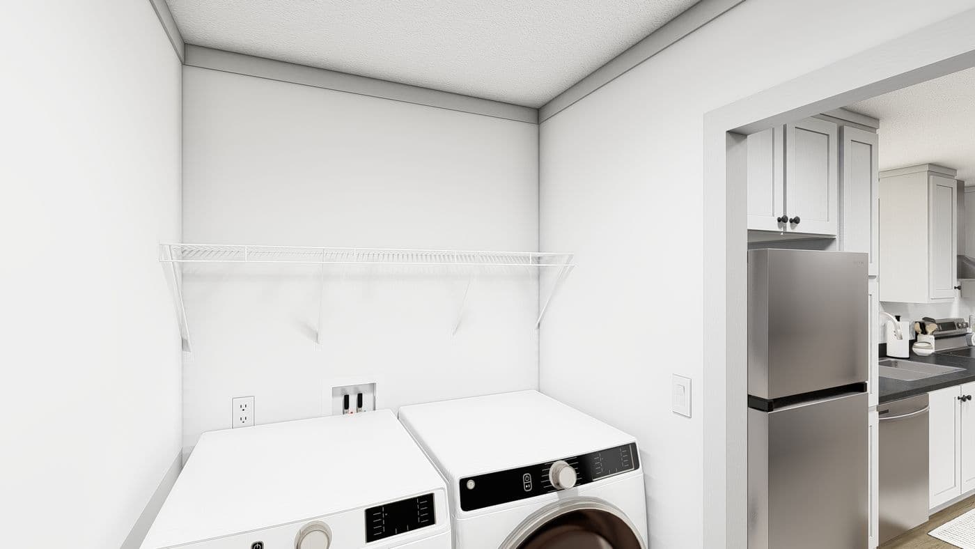 The WONDERFUL WORLD Utility Room. This Manufactured Mobile Home features 3 bedrooms and 2 baths.