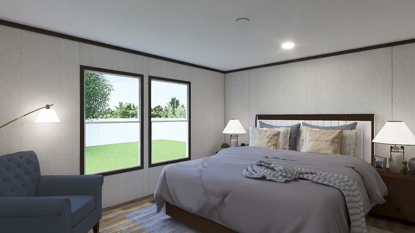 The AMBITION Primary Bedroom. This Manufactured Mobile Home features 4 bedrooms and 2 baths.