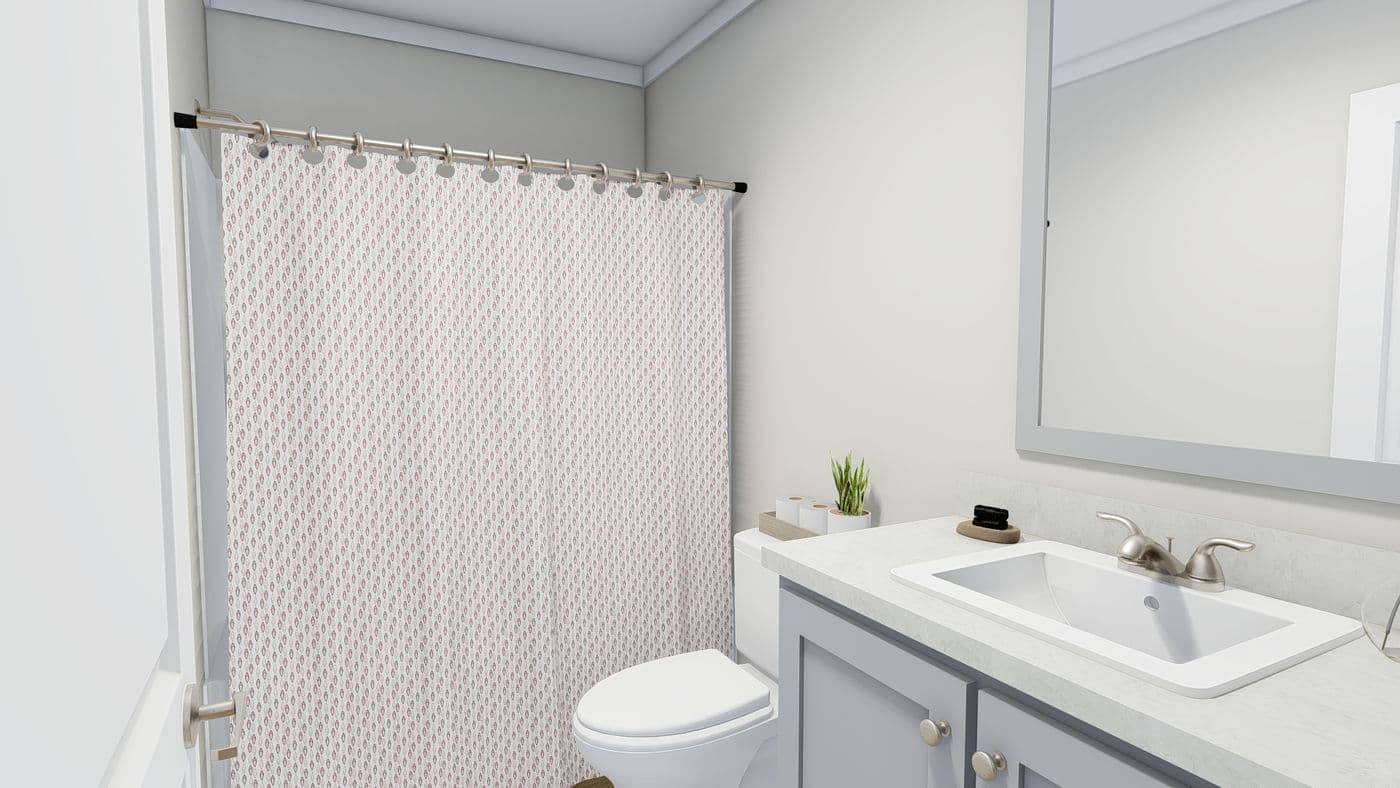 The SUNDANCE 48B Guest Bathroom. This Manufactured Mobile Home features 3 bedrooms and 2 baths.