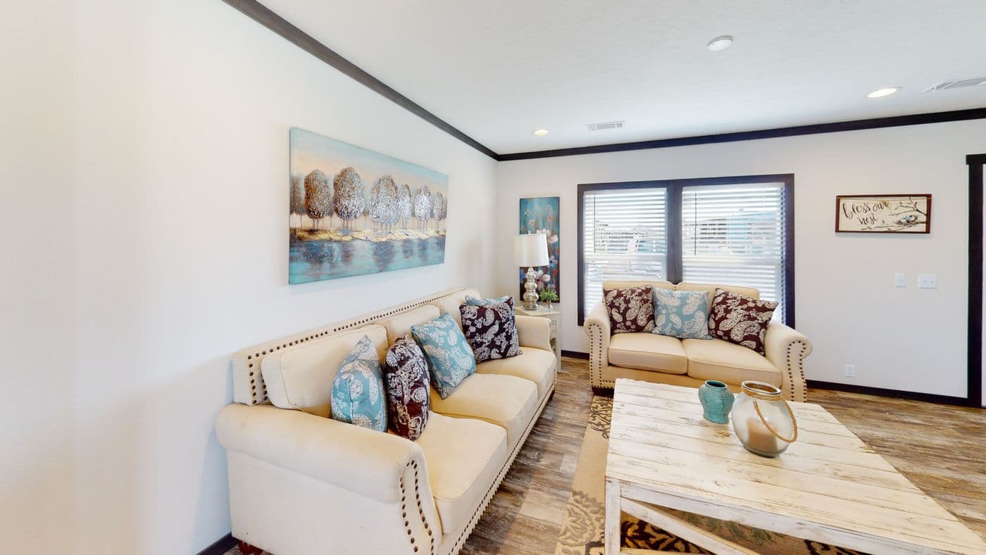 The BOUJEE XL 2 Living Room. This Manufactured Mobile Home features 4 bedrooms and 3 baths.