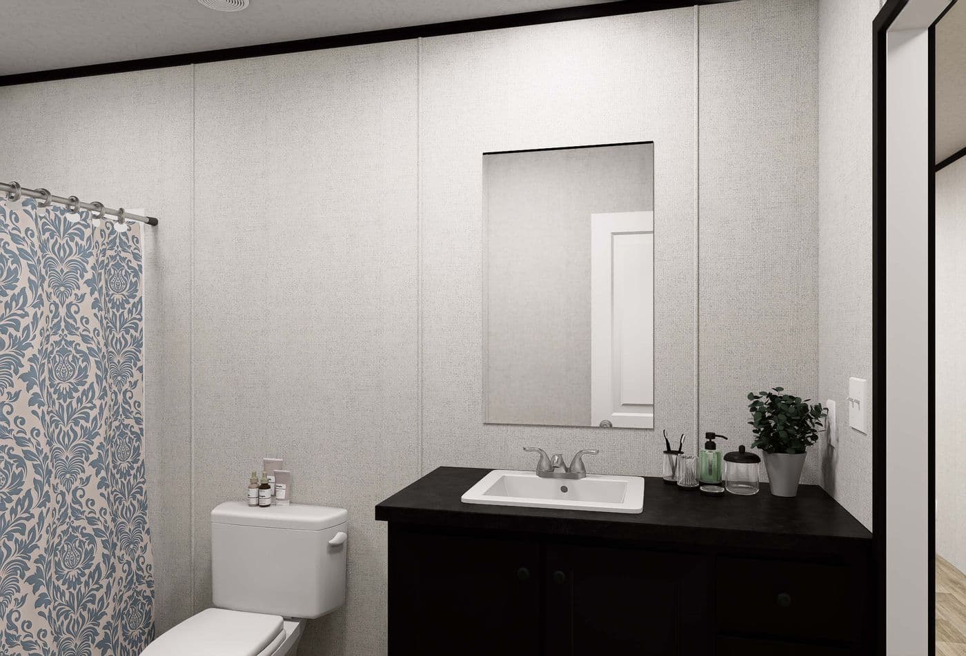 The DAWN Guest Bathroom. This Manufactured Mobile Home features 3 bedrooms and 2 baths.