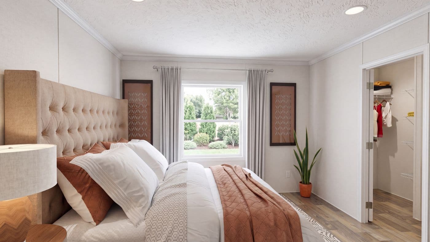 The HICKORY Primary Bedroom. This Manufactured Mobile Home features 3 bedrooms and 2 baths.