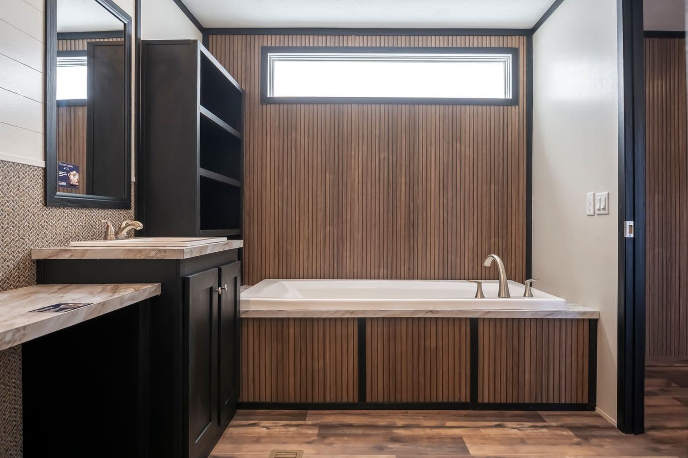 The RAVENWOOD Primary Bathroom. This Manufactured Mobile Home features 3 bedrooms and 2 baths.